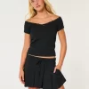 Ψηλόμεσο Mini Skort με πλισέ Ψηλόμεσο Mini Skort με πλισέ