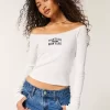 Γραφικό μπλουζάκι με δαντέλα Off-the-Shoulder Montauk Γραφικό μπλουζάκι με δαντέλα Off-the-Shoulder Montauk