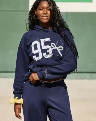 Υπερμεγέθη γραφικά κουκούλα Varsity Υπερμεγέθη γραφικά κουκούλα Varsity